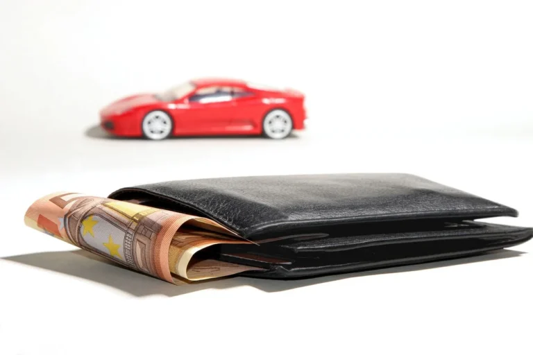 Shoppers reviewing auto preapproval papers and car keys at a kitchen table